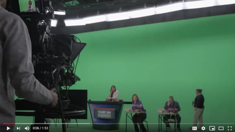 A person standing on a stageDescription automatically generated